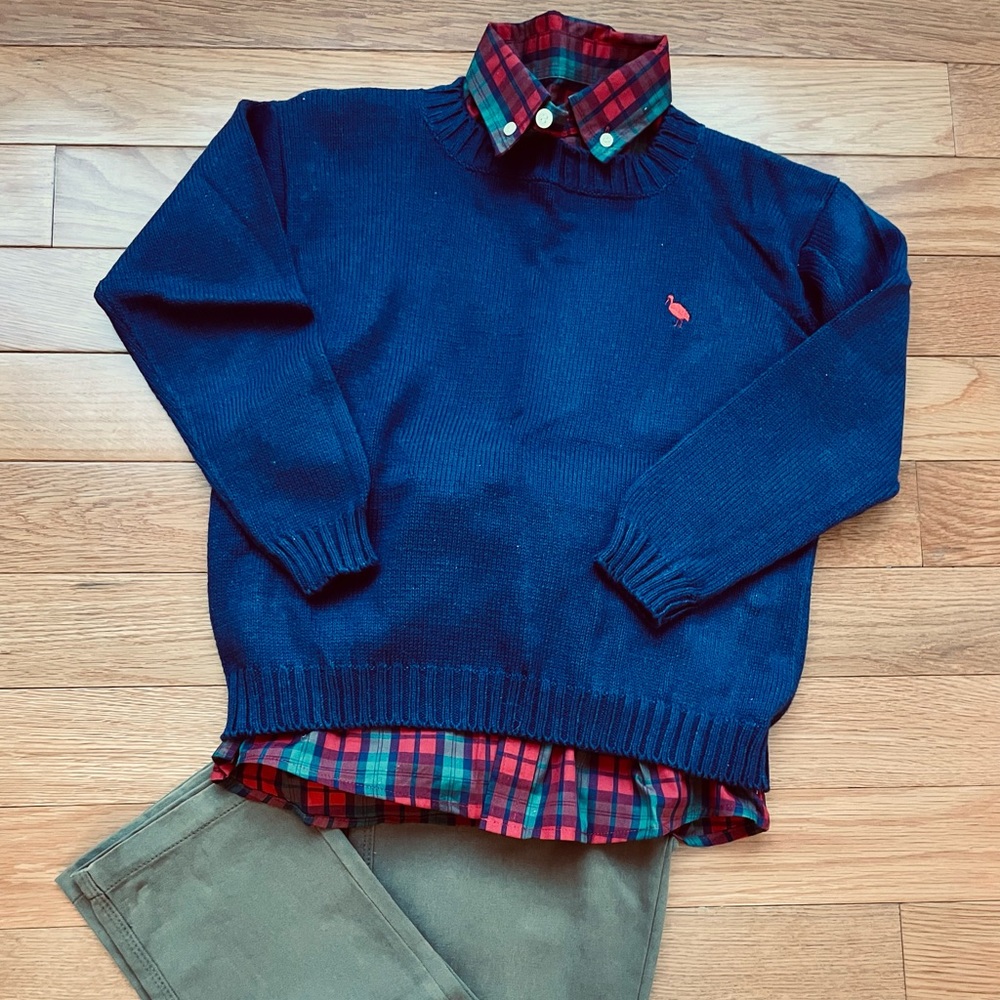 Boys outfit: khaki pants, long sleeved Oxford shirt and pullover sweater.